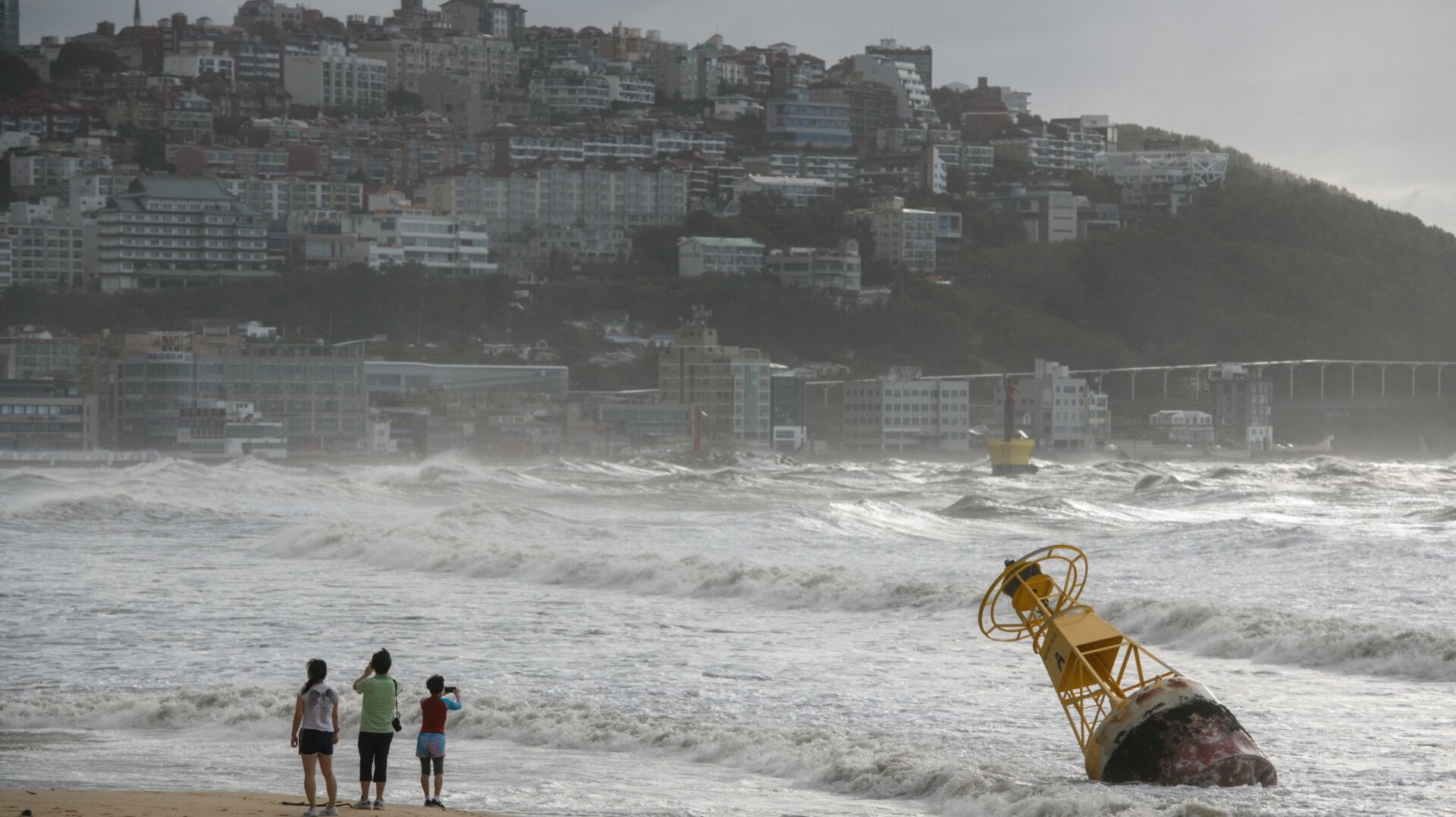 A buoy became that untethered during heavy swell brought by Typhoon Maysak overnight on a beach in Busan on September 3, 2020.