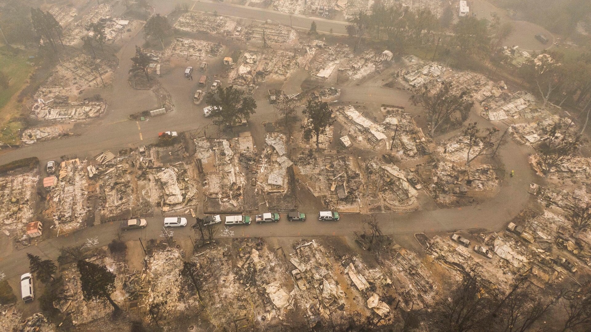 Search and rescue vehicles from the Jackson County Sheriff’s Office are seen in a mobile home park that was destroyed by wildfire in Ashland, Oregon.