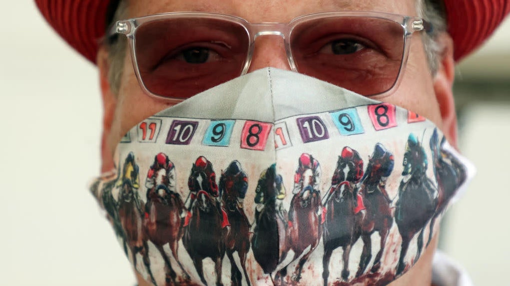 An essential track worker wears a mask ahead of the 146th running of the Kentucky Derby at Churchill Downs on September 04, 2020, in Louisville, Kentucky. 