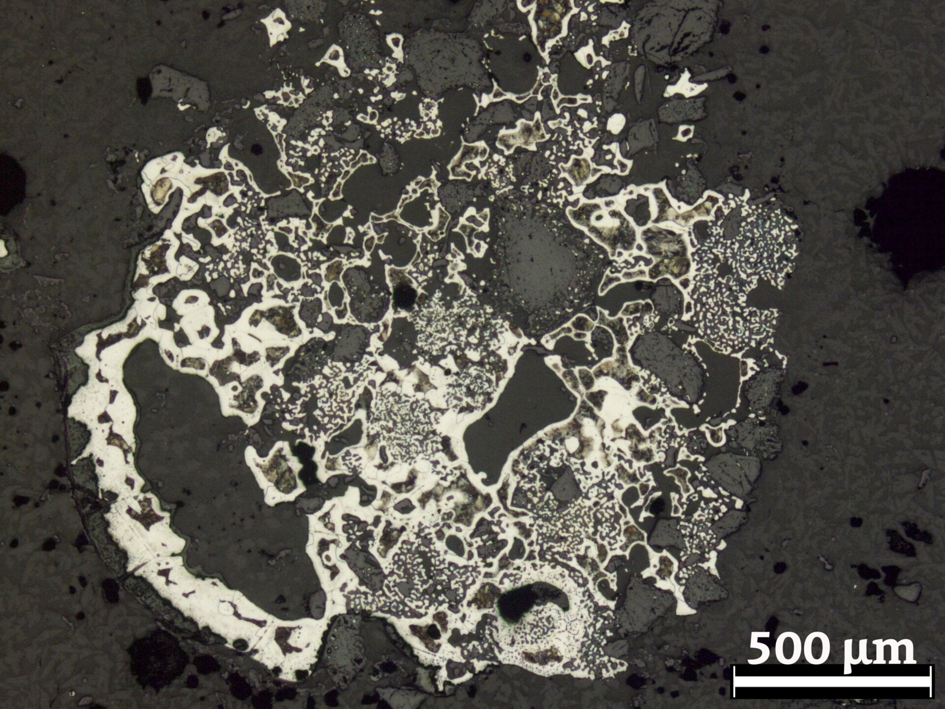 A large chunk of steel trapped in crucible slag. 