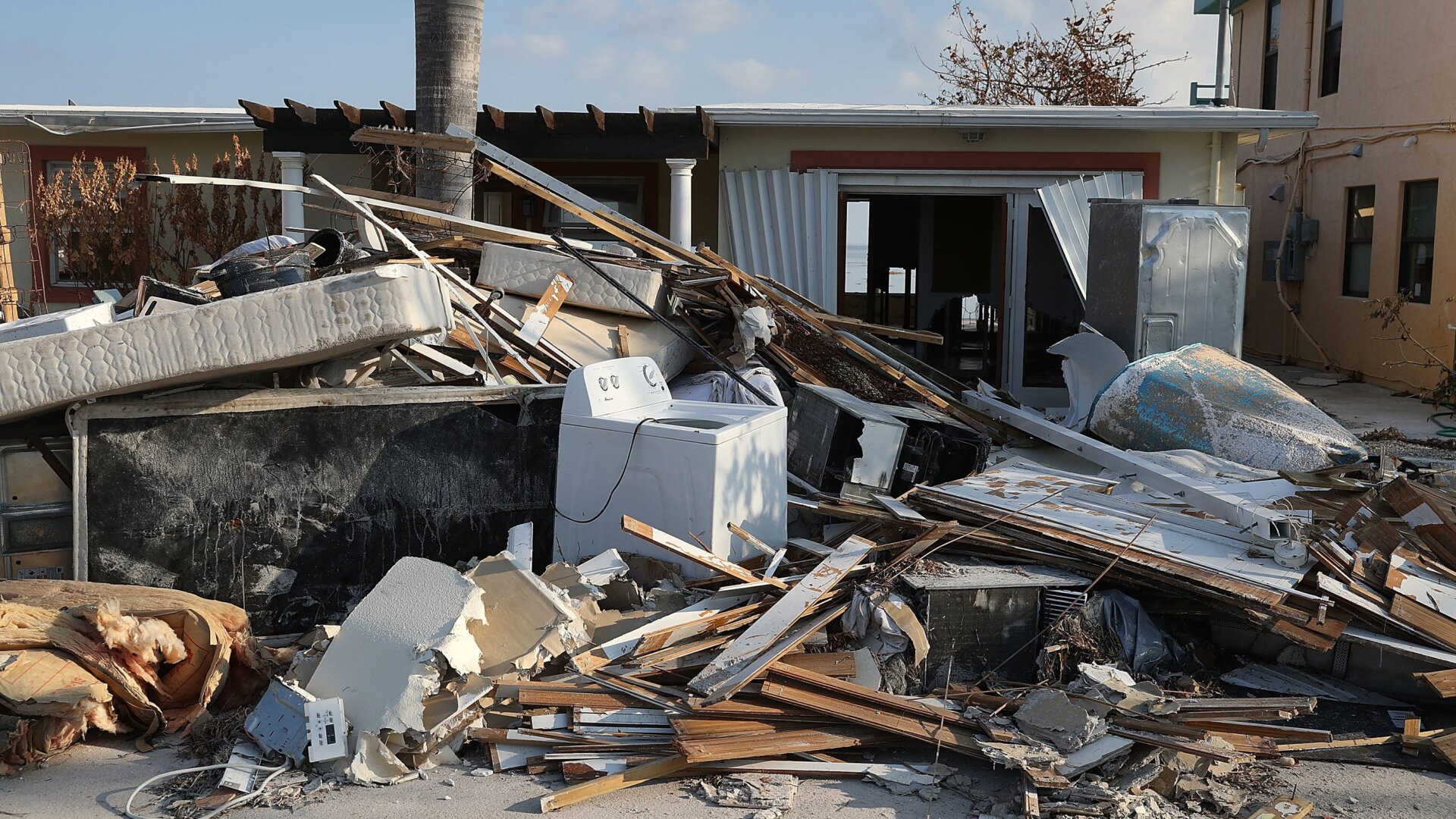 Debris sits in front of a home that was damaged by hurricane Irma on September 19, 2017 in Marathon, Florida.