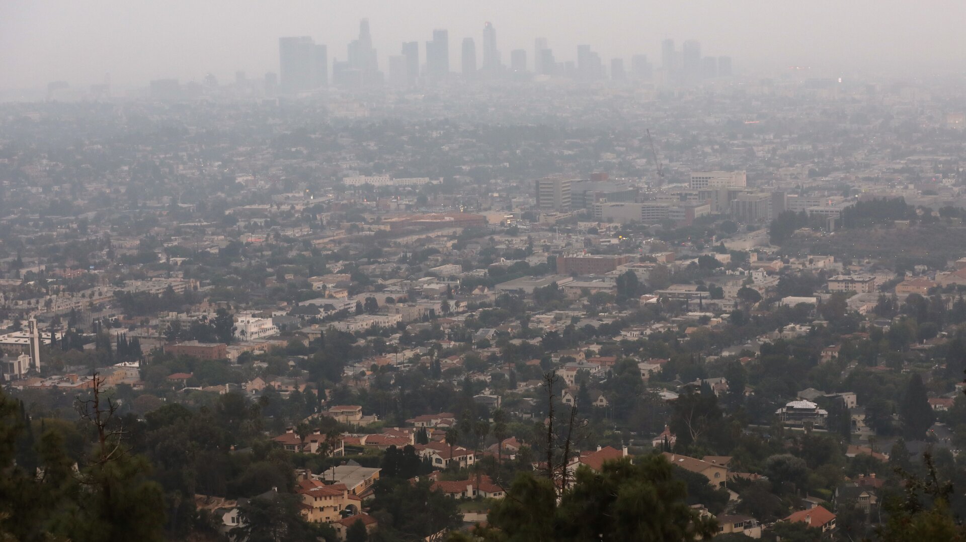 The downtown skyline partially obscured by smoke from wildfires after sunset on September 13, 2020 in Los Angeles, California.