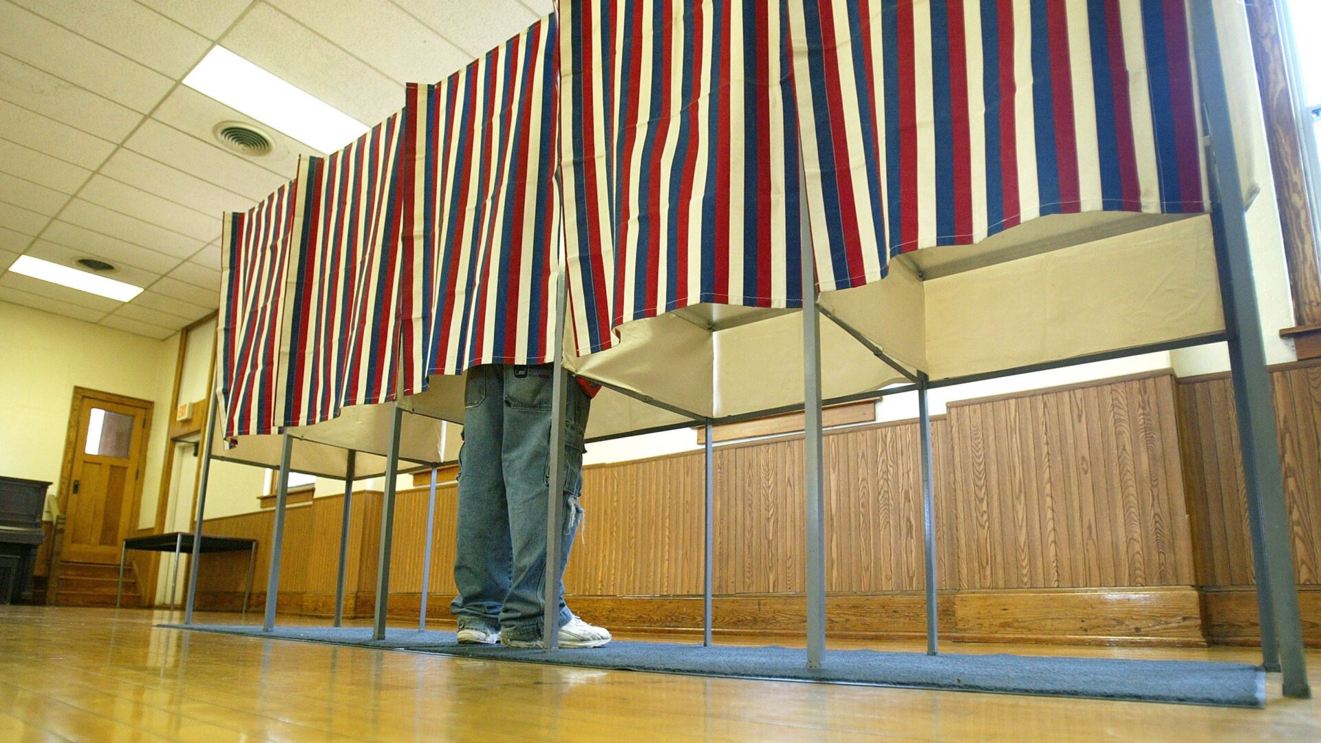 A lone voter casts his ballot in a booth at a polling location November 4, 2004 in Hazel Green, Wisconsin.