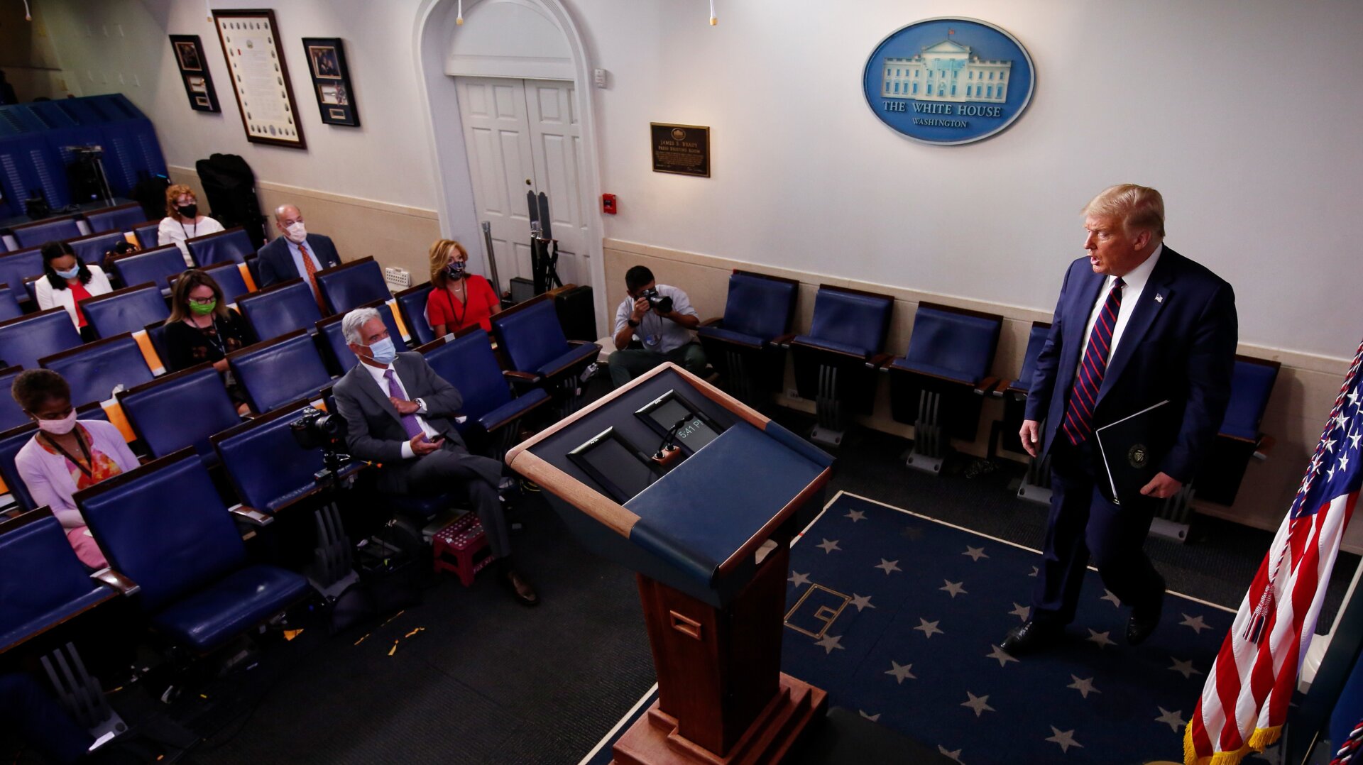 U.S. President Donald Trump arrives at a news conference in the James Brady Briefing Room of the White House July 30, 2020.
