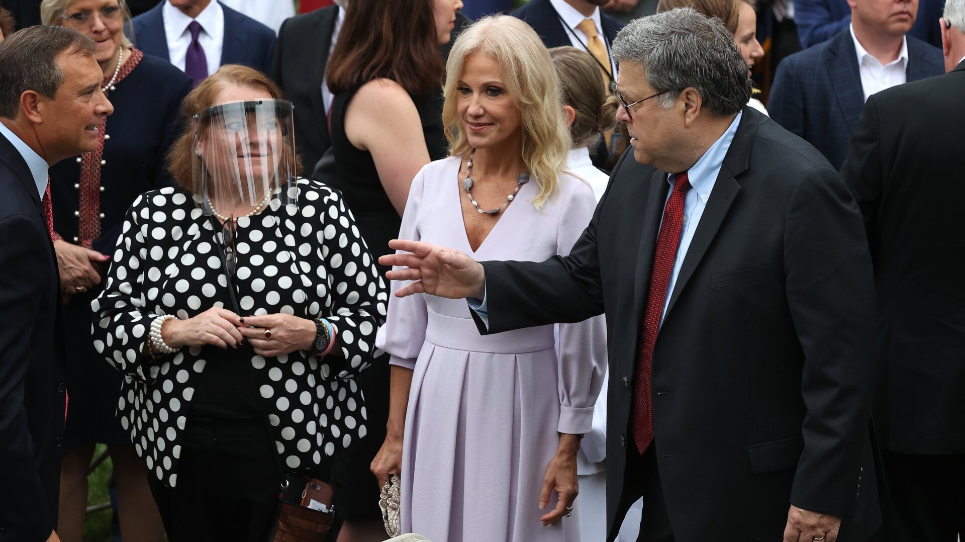 Kellyanne Conway (center) is seen with Attorney General William Barr (right) and guests at the Rose Garden Supreme Court nomination event on Sept. 26. At least seven people in attendance that day have tested positive for covid-19 since, including President Donald Trump.