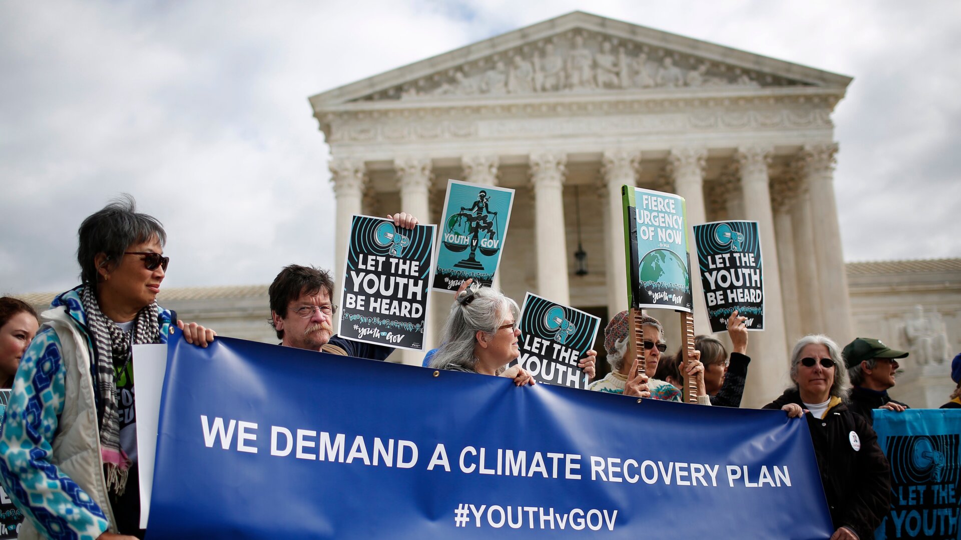 Protesters attend a 2018 rally outside the Supreme Court held by the group Our Children’s Trust in Washington, DC.
