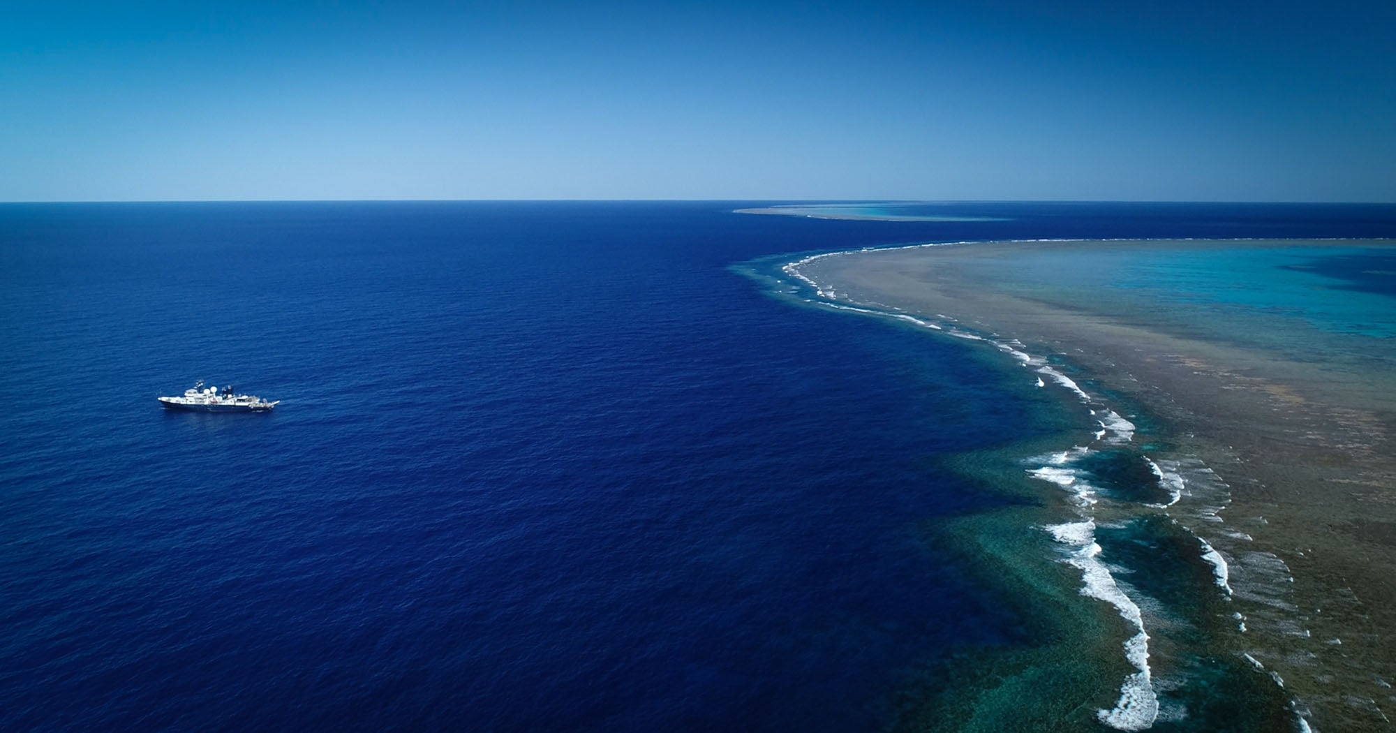 Research vessel Falkor near the site of the newly detected detached reef.