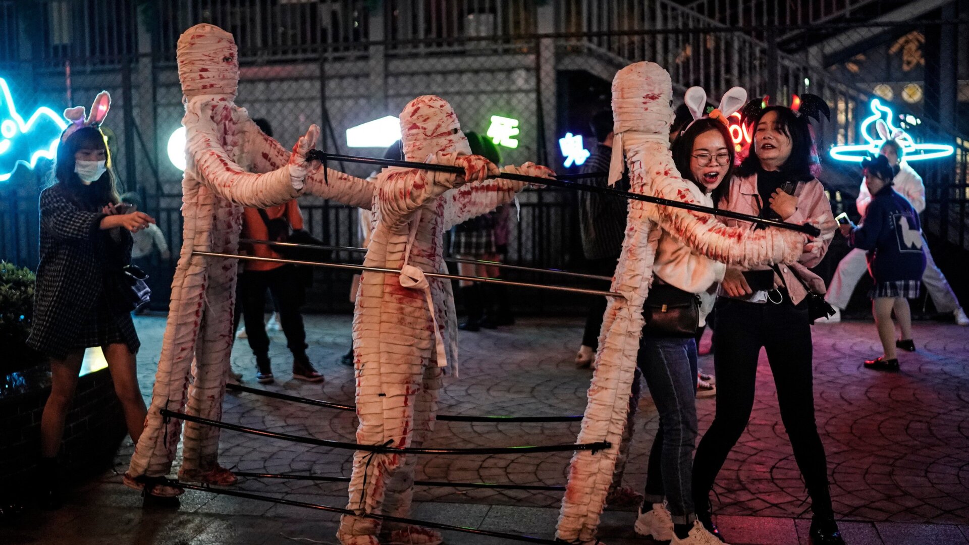People dressed in Halloween-themed costumes participate in a parade event celebrating Halloween at the Happy Valley on Oct. 29, 2020, in Wuhan, Hubei province, China.