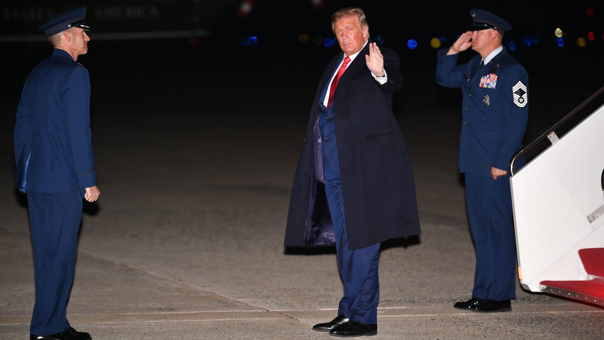 US President Donald Trump waves after stepping off Air Force One upon arrival at Andrews Air Force Base in Maryland on September 30, 2020.