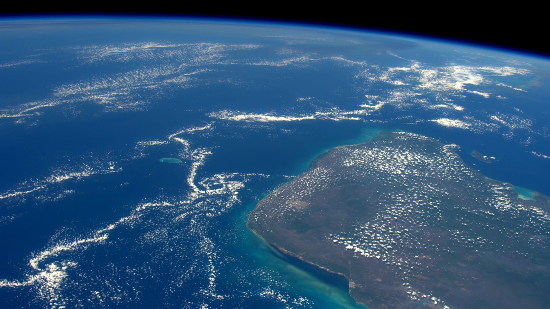 An asteroid struck the Yucatan Peninsula, seen here from the International Space Station, 66 million years ago, sparking a mass extinction event.
