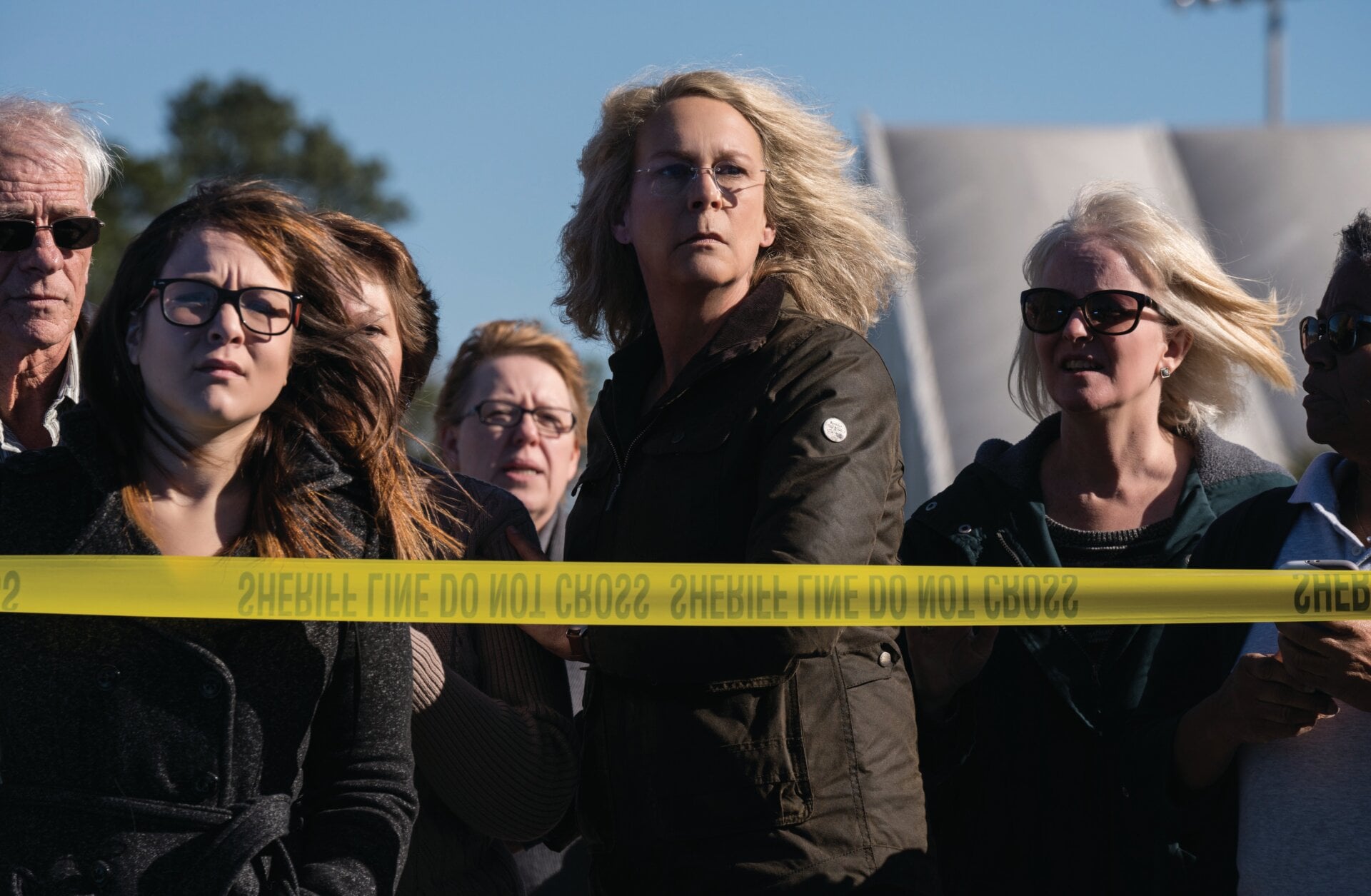 Halloween’s Laurie Strode (Jamie Lee Curtis) is used to seeing lots of crime scene tape around her hometown.