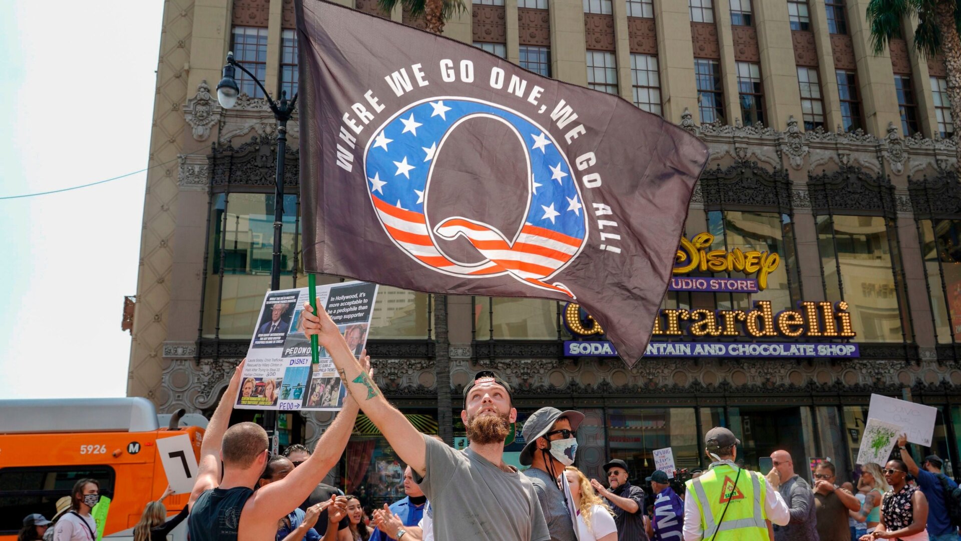 Conspiracy theorist QAnon demonstrators protest child trafficking, an issue the group has co-opted to recruit new members through hashtags like #savethechildren, on Hollywood Boulevard in Los Angeles, California, August 22, 2020.