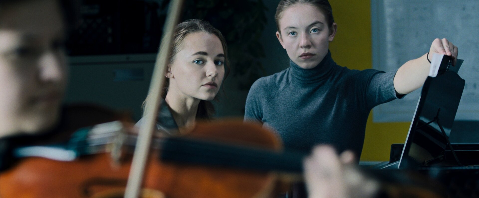 Vivian (Madison Iseman) practices while Juliet (Sydney Sweeney) turns the pages and dies inside in Nocturne.
