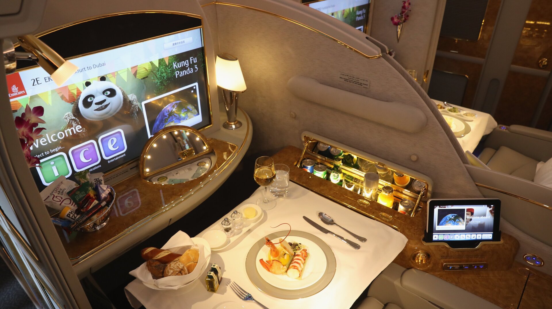A meal lies served in a compartment in first class on board an Emirates A380 passenger plane.