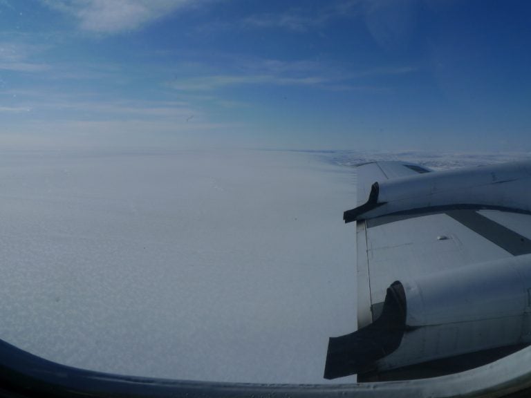 NASA’s Operation IceBridge at work, flying over a vast Greenland ice sheet.