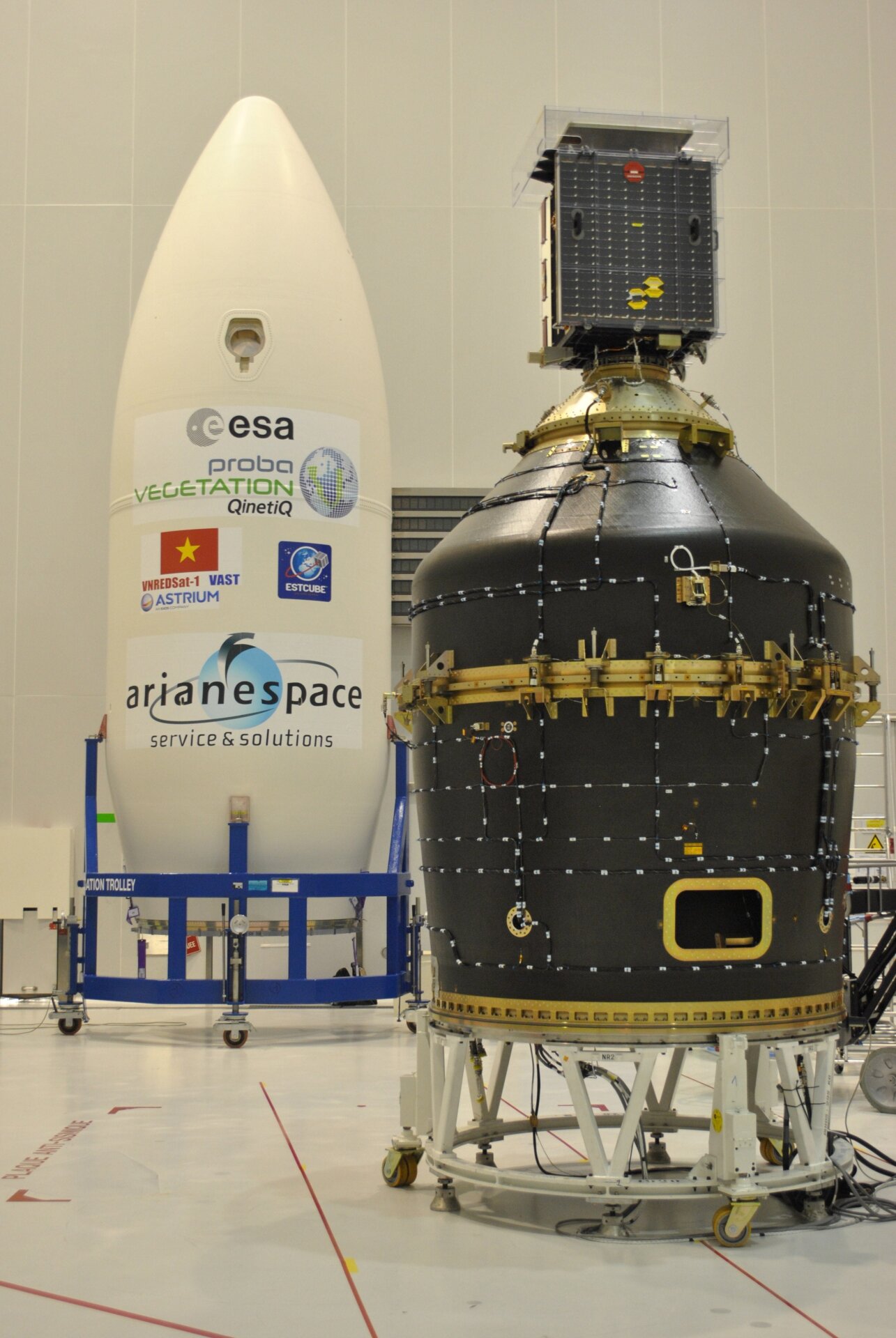 Archival image from 2013 showing the Vespa (Vega Secondary Payload Adapter) adapter in the background, with the Proba-V satellite in the foreground. 