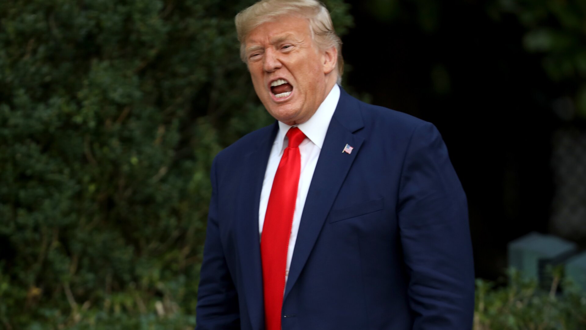 Donald Trump shouts at members of the media in October 2019.