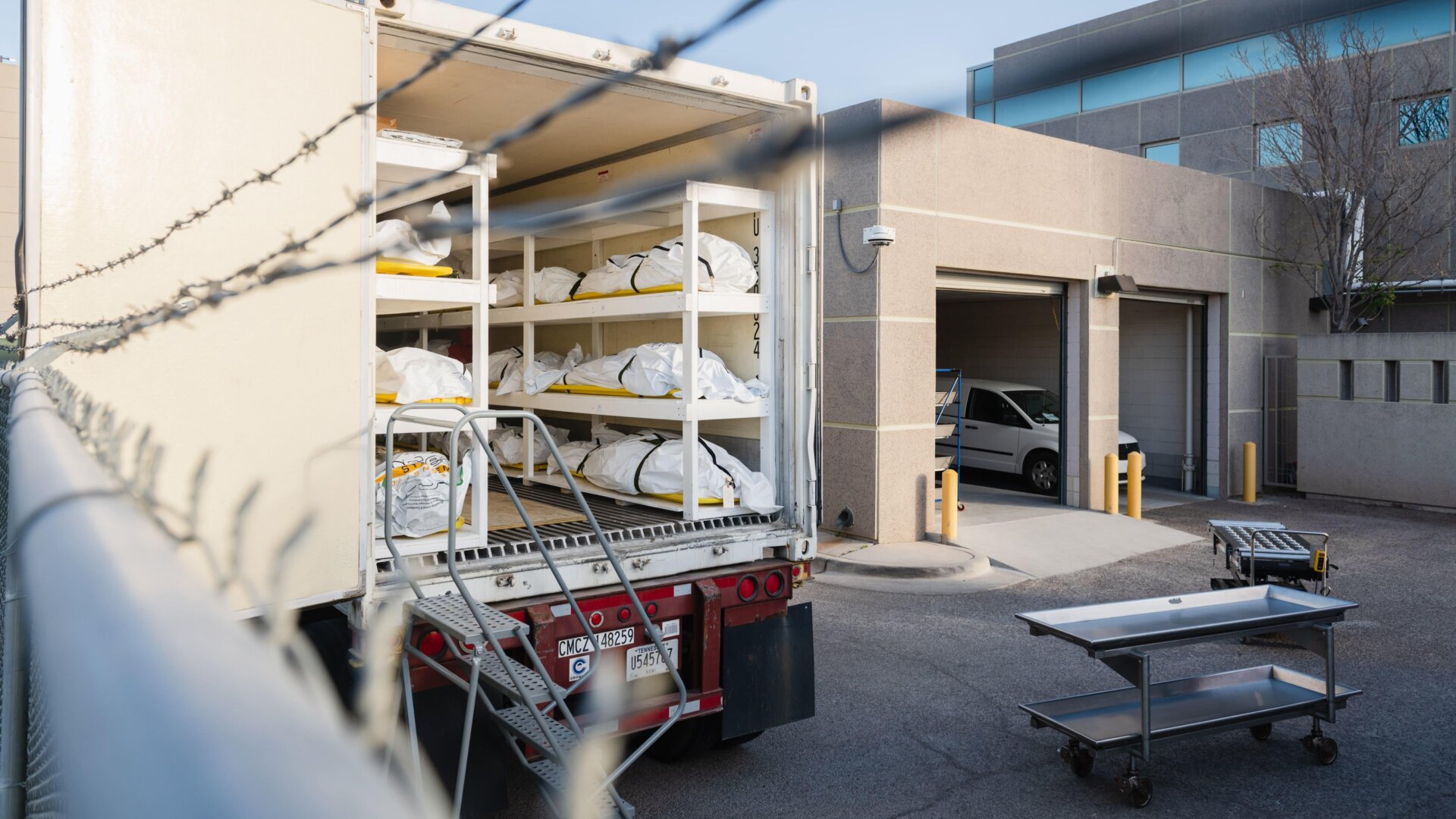 Bodies wrapped in plastic line the walls inside a refrigerated trailer used as a mobile morgue by the El Paso County Medical Examiner’s office in El Paso, Texas on November 13, 2020.