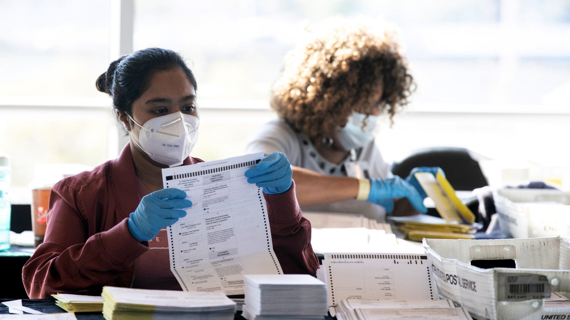 Election workers count Fulton County ballots at the State Farm Arena on November 4, 2020 in Atlanta, Georgia.