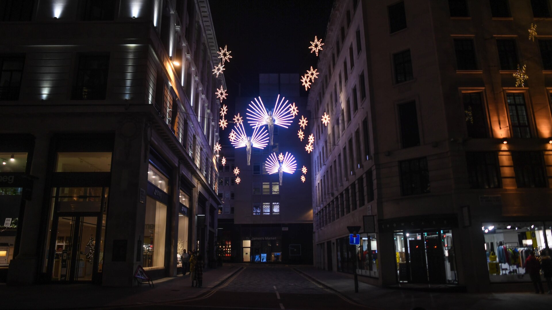 Festive lights light an empty street on December 20, 2020 in London, England. London and large parts of southern England were moved into a newly created “Tier 4" lockdown, closing non-essential shops and limiting household mixing.