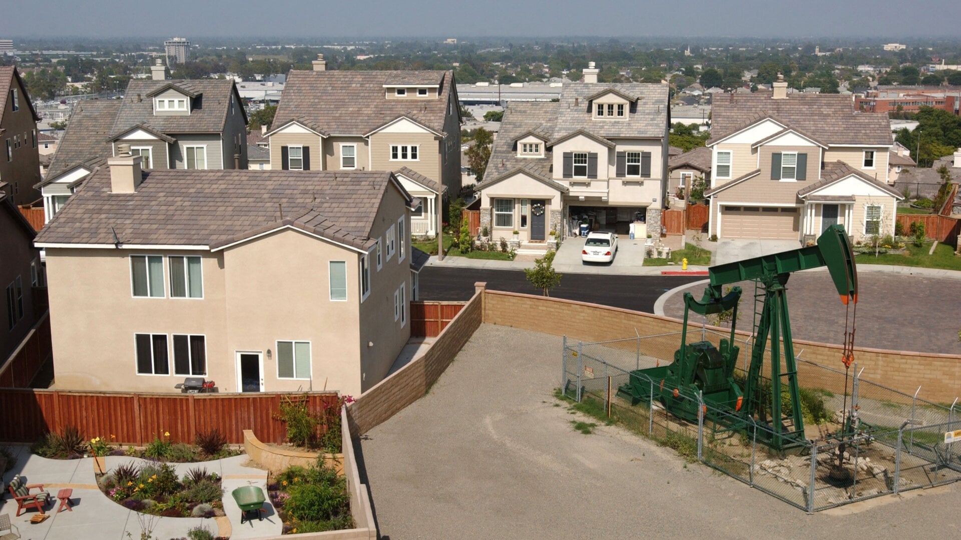 An oil well pumps in a neighborhood near Shell Oil Company Alamitos No. 1 discovery well on Signal Hill. Alamitos No. 1 was created in 1921 and helped establish California as one of the world’s major oil-producing states.