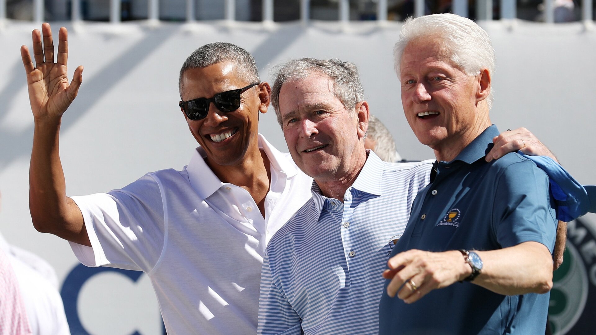 Barack Obama, George W. Bush, and Bill Clinton attending the trophy presentation at the 2017 Presidents Cup held at the Liberty National Golf Club.