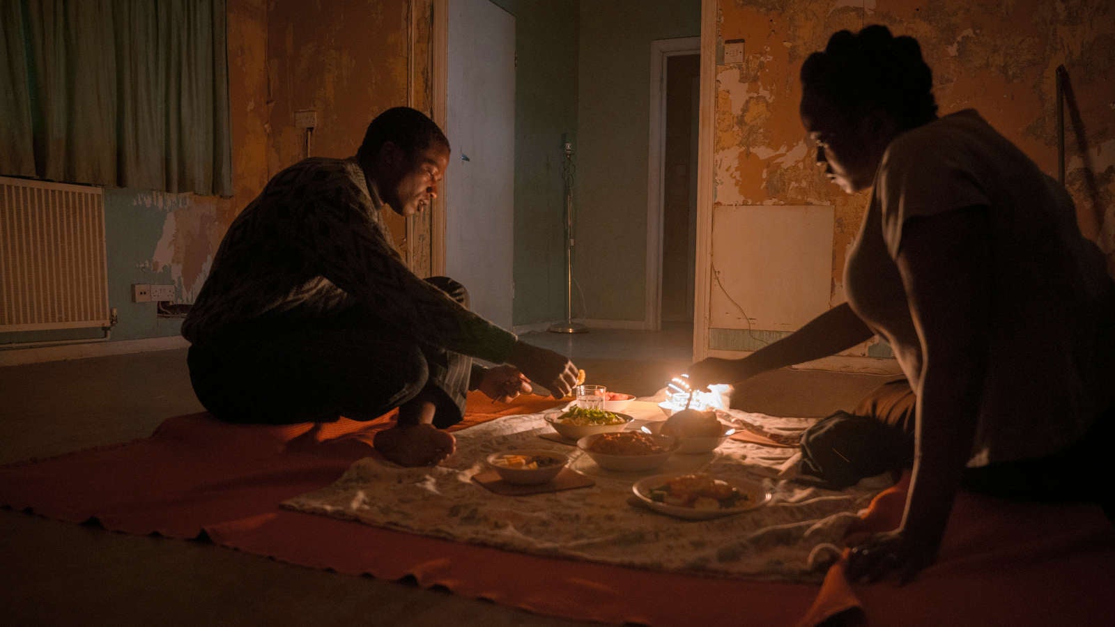 His House’s Bol (Ṣọpẹ́ Dìrísù) and Rial (Wunmi Mosaku) settle into their unsettling new home in England.