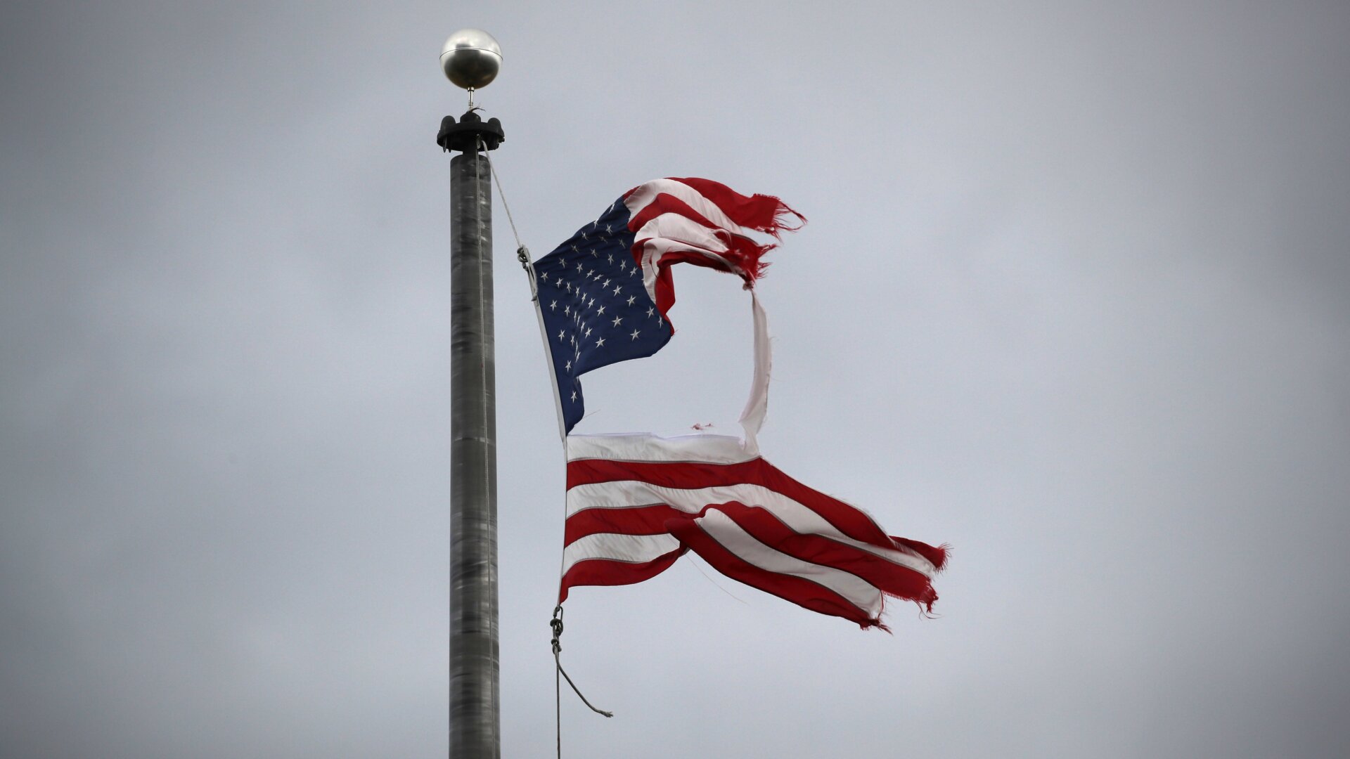 An American flag flies over the entrance to a disaster morgue holding the bodies of people who died of covid-19 at South Brooklyn Marine Terminal in New York City.