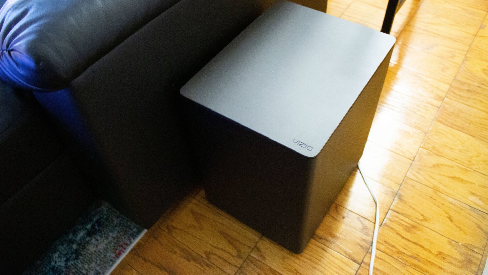 I had to put the subwoofer here because the rear satellites need to connect to it. 