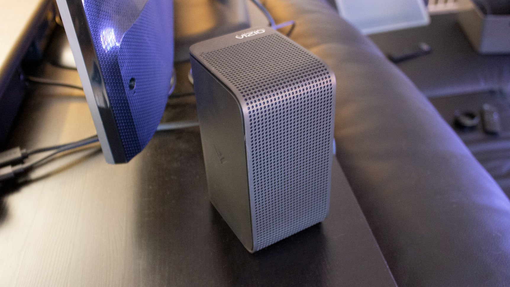 A rear upward-firing satellite speaker. Also pictured: my second TV hooked up a different soundbar.