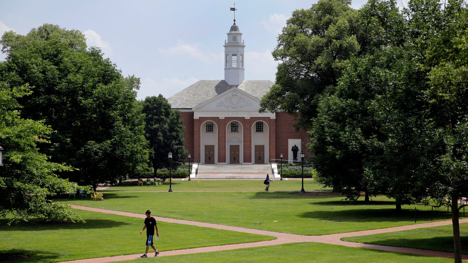 File photo of people walking on Johns Hopkins University’s Homewood campus in Baltimore.