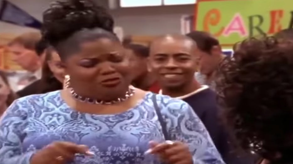 Nikki having a conversation with Kim while T looks on.