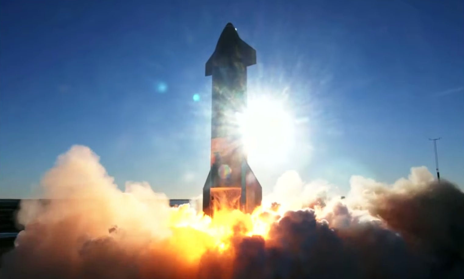 The prototype blasting off from the launch pad. 