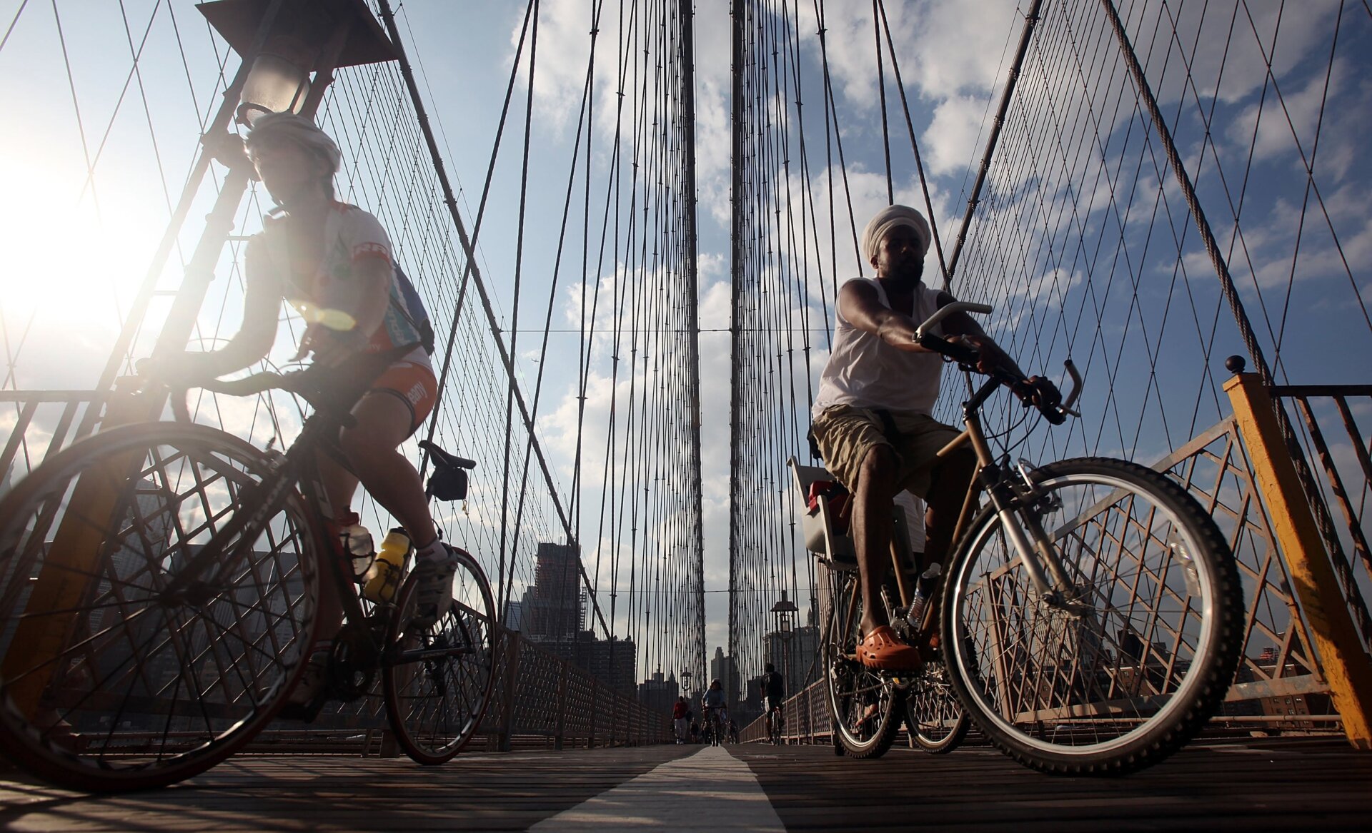 Cyclists ride across the Brooklyn Bridge during the evening commute Aug. 25, 2009 in New York City.