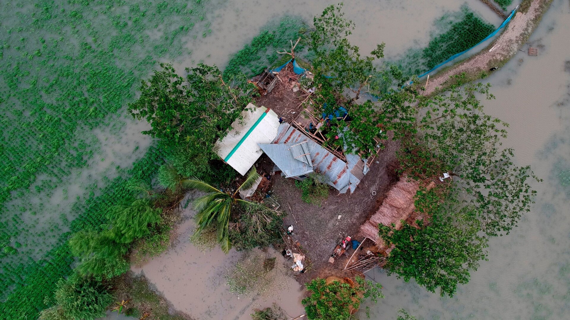 This aerial photo taken on November 10, 2019, shows a destroyed house after cyclone Bulbul hit Koyra, Bangladesh.