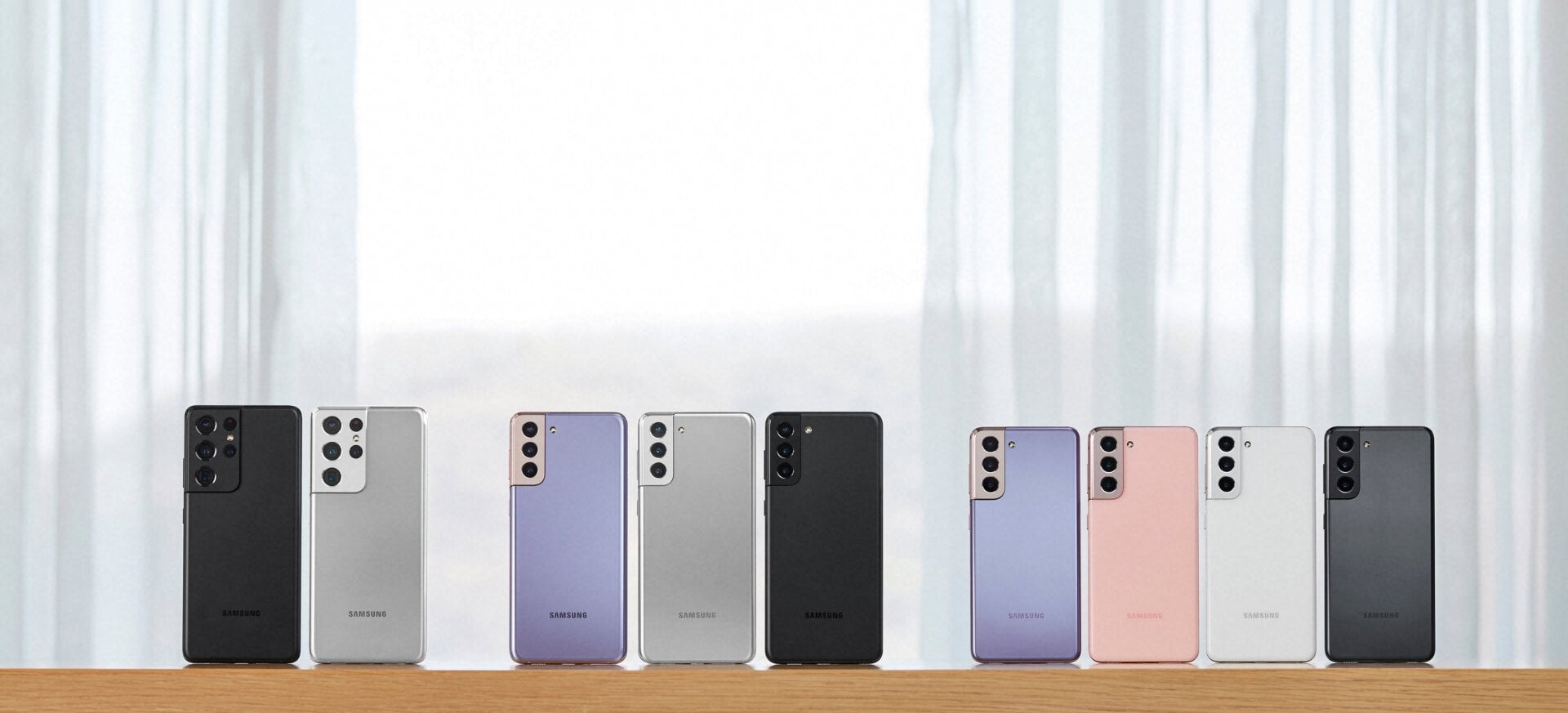 Here’s the full S21 family from left to right: the S21 Ultra in black and silver, the S21+ in purple, silver, and black, and the standard S21 in purple, pink, silver, and black.