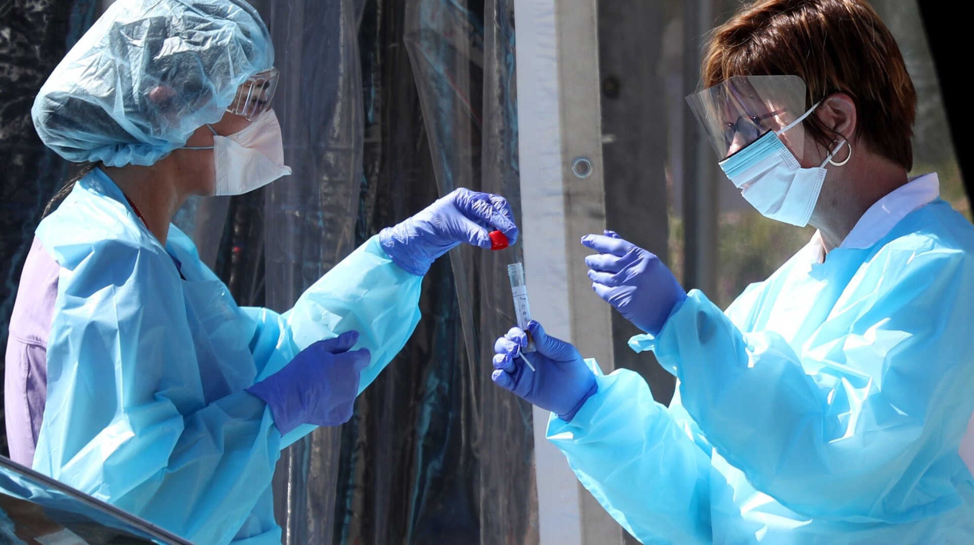 Health care workers at a drive-thru covid-19 testing station in San Francisco, California last March.