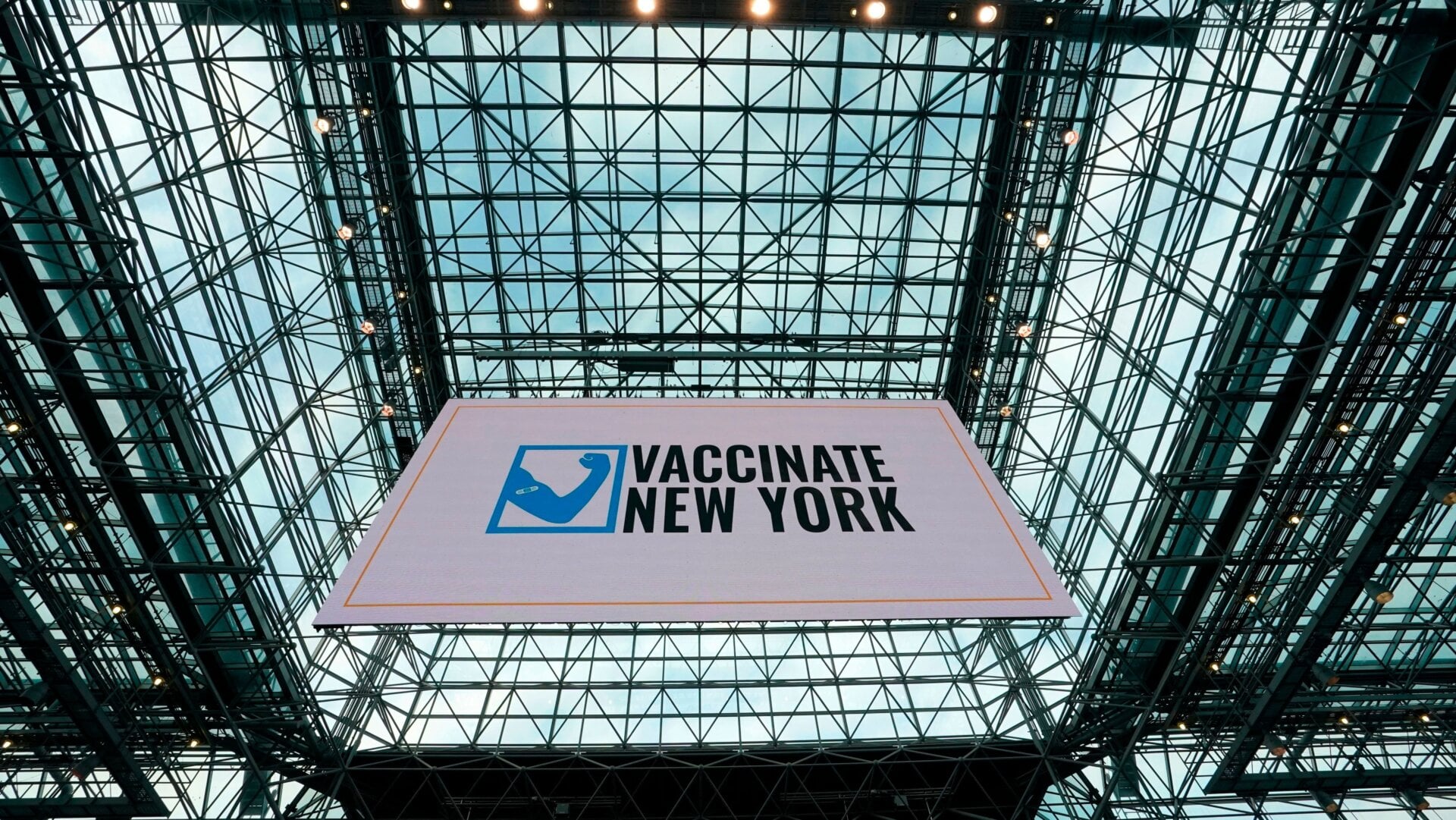 A banner hangs from the ceiling at the Jacob K. Javits Convention Center on January 13, 2021 during a media tour of the new state vaccination site in New York City.