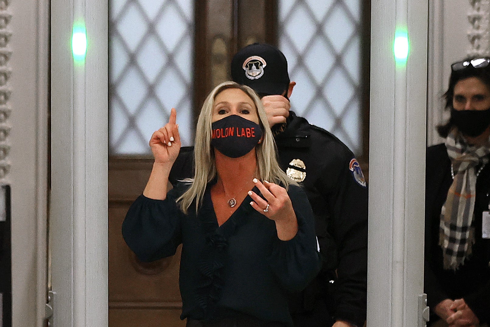 Rep. Marjorie Taylor Greene (R-GA) yells at journalists after setting off the metal detector outside the doors to the House of Representatives Chamber on January 12, 2021 in Washington, DC. 