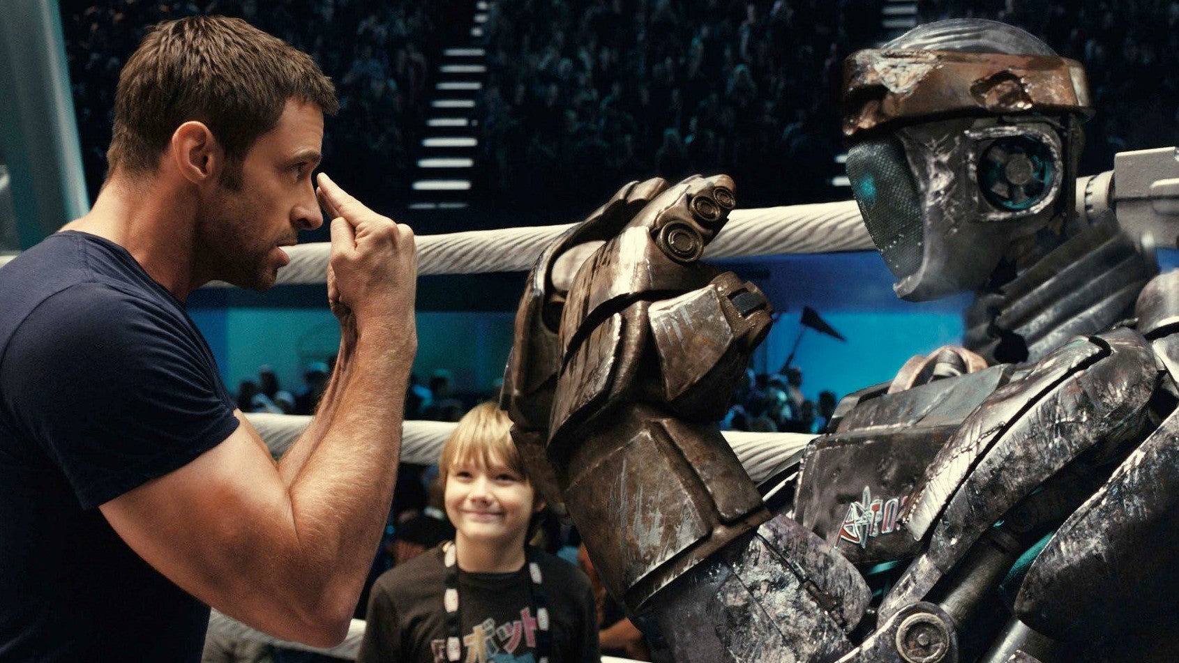 Hugh Jackman training a robot fighter in Real Steel.