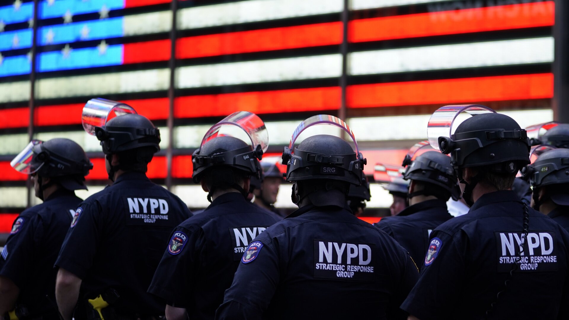 NYPD police officers watch demonstrators in Times Square on June 1, 2020, during a “Black Lives Matter” protest.