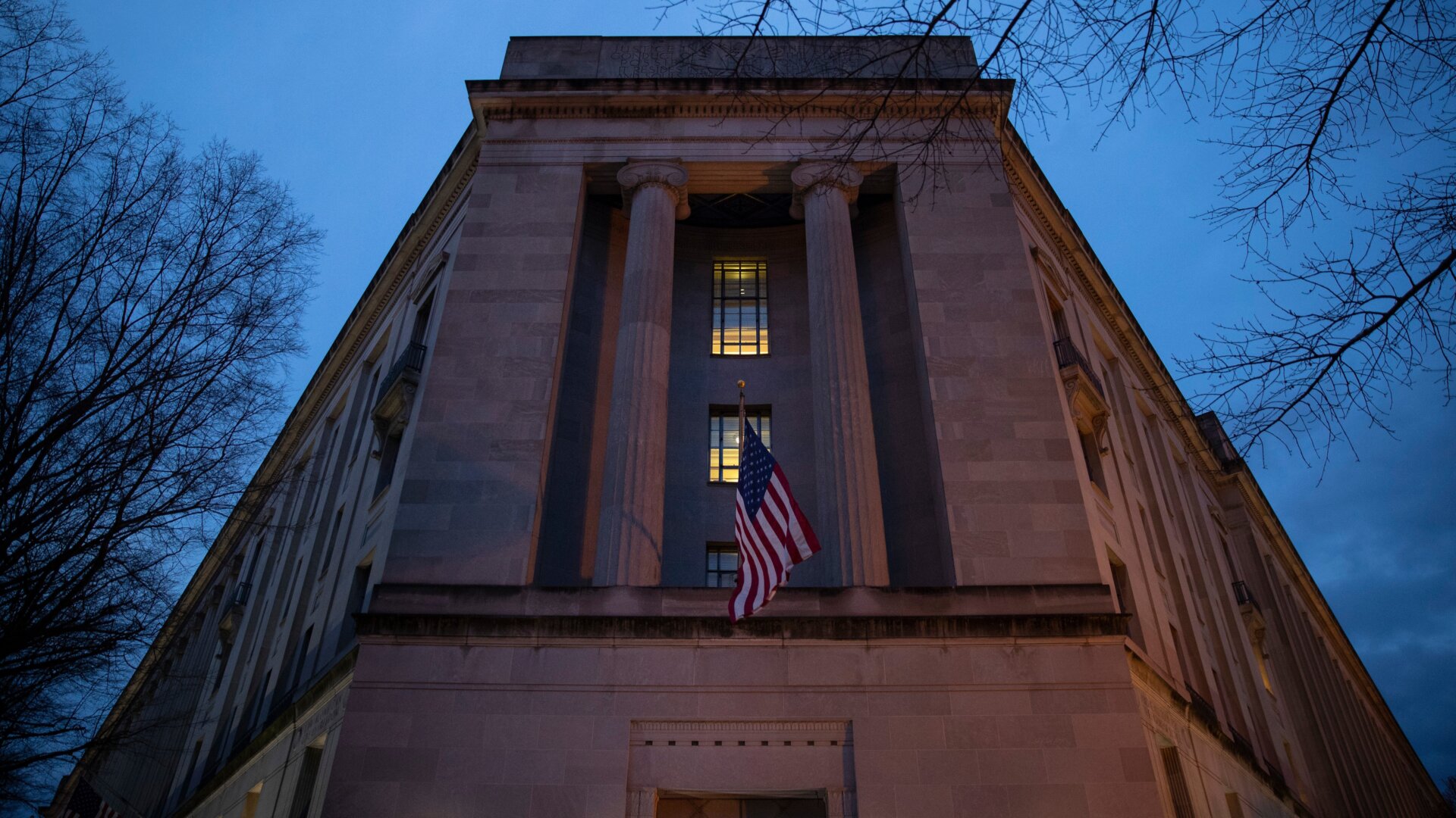 The Department of Justice stands in the early hours of Friday morning, March 22, 2019 in Washington, DC.