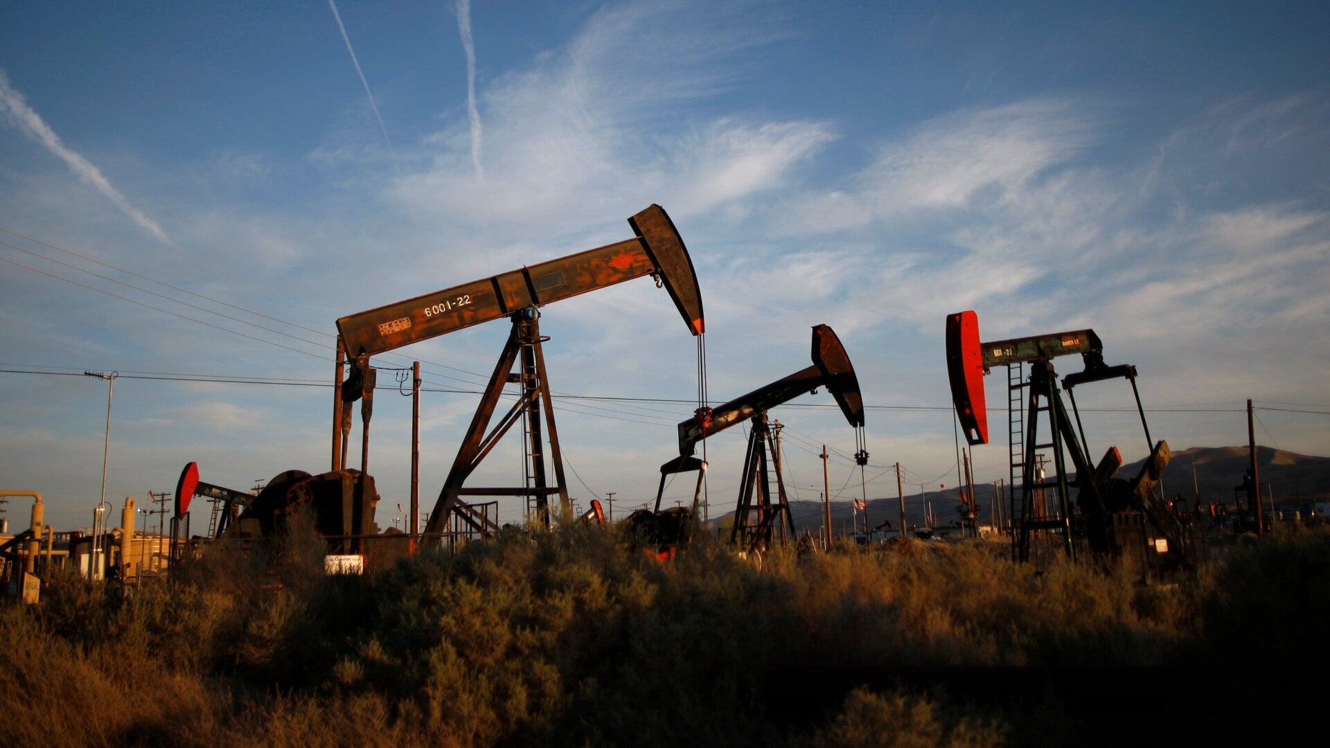 Pump jacks and wells are seen in an oil field on the Monterey Shale formation where gas and oil extraction uses fracking.