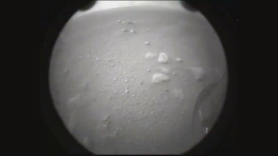 The second image transmitted to Earth after the landing, with the rover’s wheel visible at right.