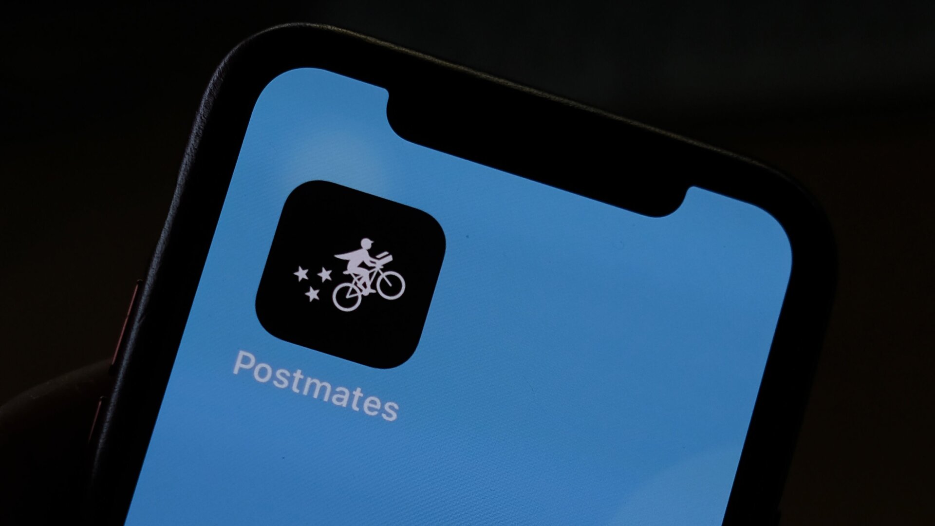 This illustration photo taken on June 30, 2020 shows the logo of delivery app Postmates on a smartphone screen in Los Angeles.
