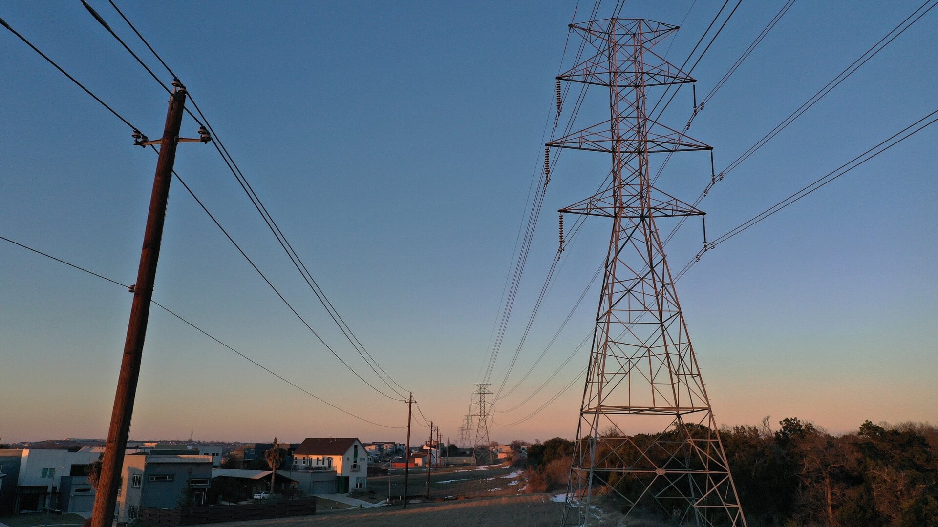 An aerial view from a drone shows electrical power lines running through a neighborhood on Feb. 19, 2021 in Austin, Texas. Amid days of nationwide frigid winter storms in which 58 people died, more than 4 million Texans were without power for much of the past week, with about 13 million Texans being forced to boil tap water in the aftermath of the strain on infrastructure.