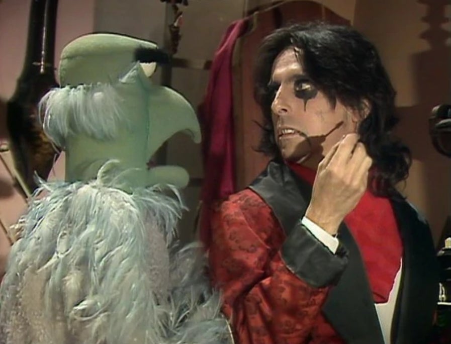 Sam the Eagle telling Alice Cooper he thinks his drag sucks.