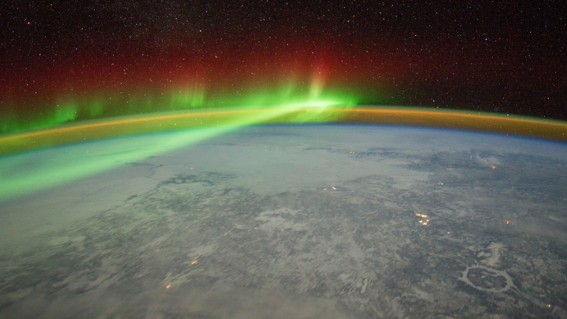 An astronaut aboard the International Space Station adjusted the camera for night imaging and captured the green veils and curtains of an aurora over Quebec, Canada.