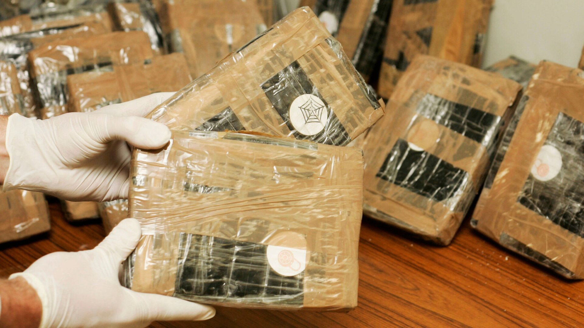 Belgian federal police handling seized cocaine in Brussels in April 2007; stock photo.