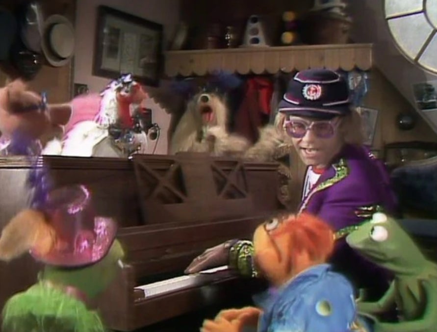 Elton John singing with the Muppets.